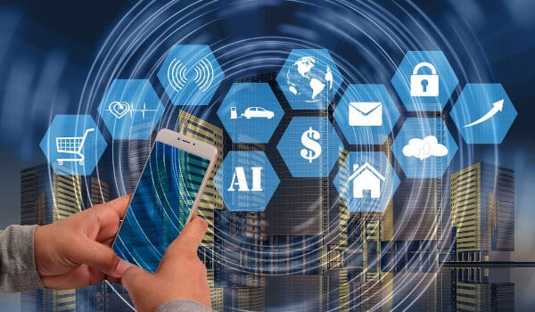 Hands holding a smartphone with AI and technology icons over a cityscape background.