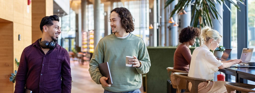 two workers walking through a flexible workspace