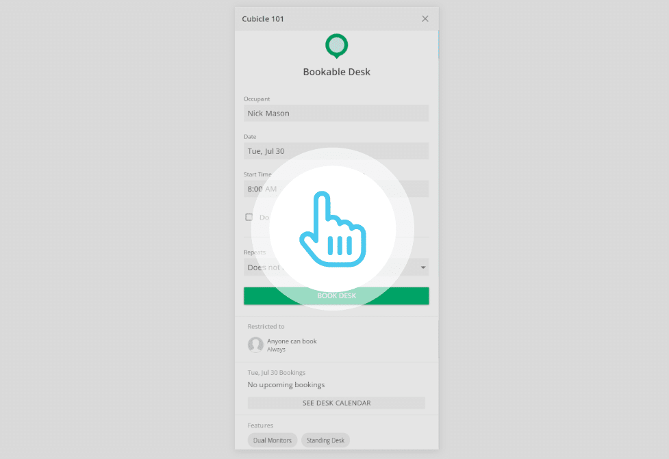Interactive booking screen with a hand icon pointing at "BOOK DESK.